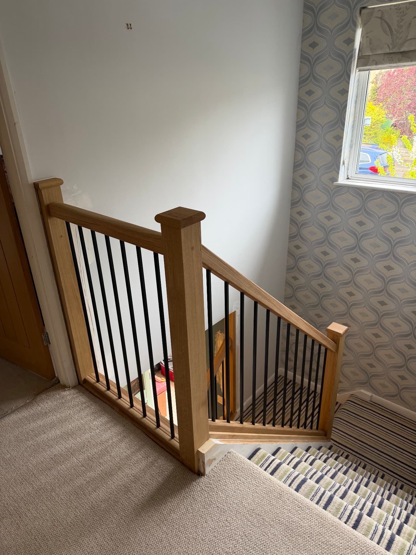 Oak understairs panelling and storage detail